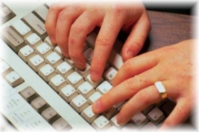 Hands on a computer keyboard